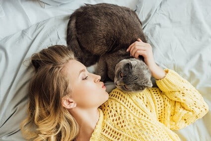 How do cats give humans kisses?